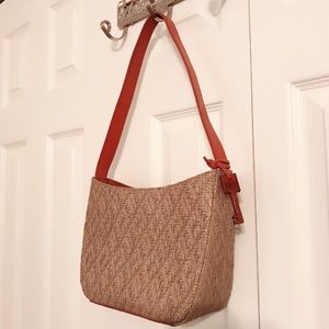Fossil tan woven shoulder purse.